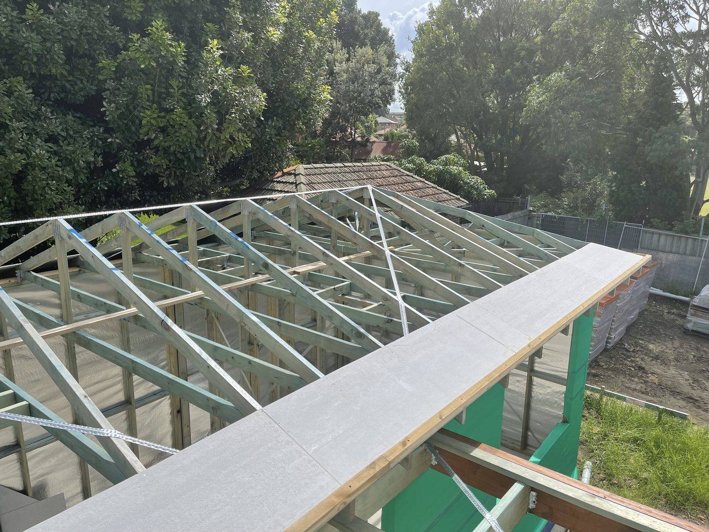 Wide view of the full extension roof structure taking shape over the framed addition, Ashfield by Loel Homes