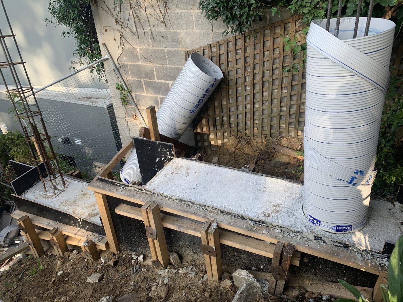 Timber-formed concrete footing with column forms by Loel Homes