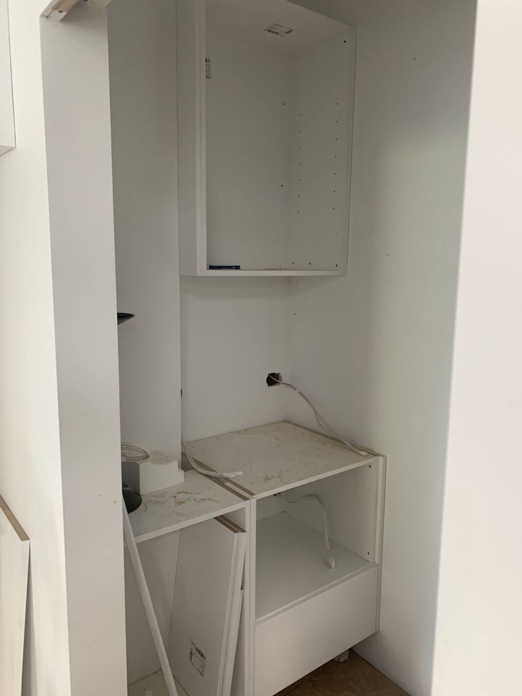 Butler's pantry and laundry joinery being installed with base cabinet, overhead cupboard and appliance recess, Dulwich Hill by Loel Homes