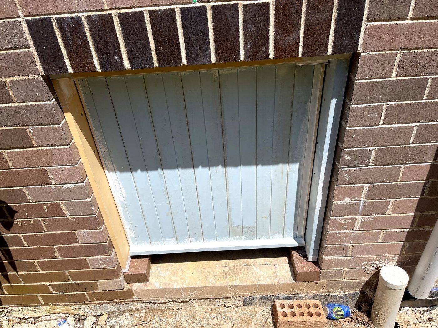 Decorative VJ beadboard infill panel set into a brick opening with a timber frame on an Eastwood home by Loel Homes