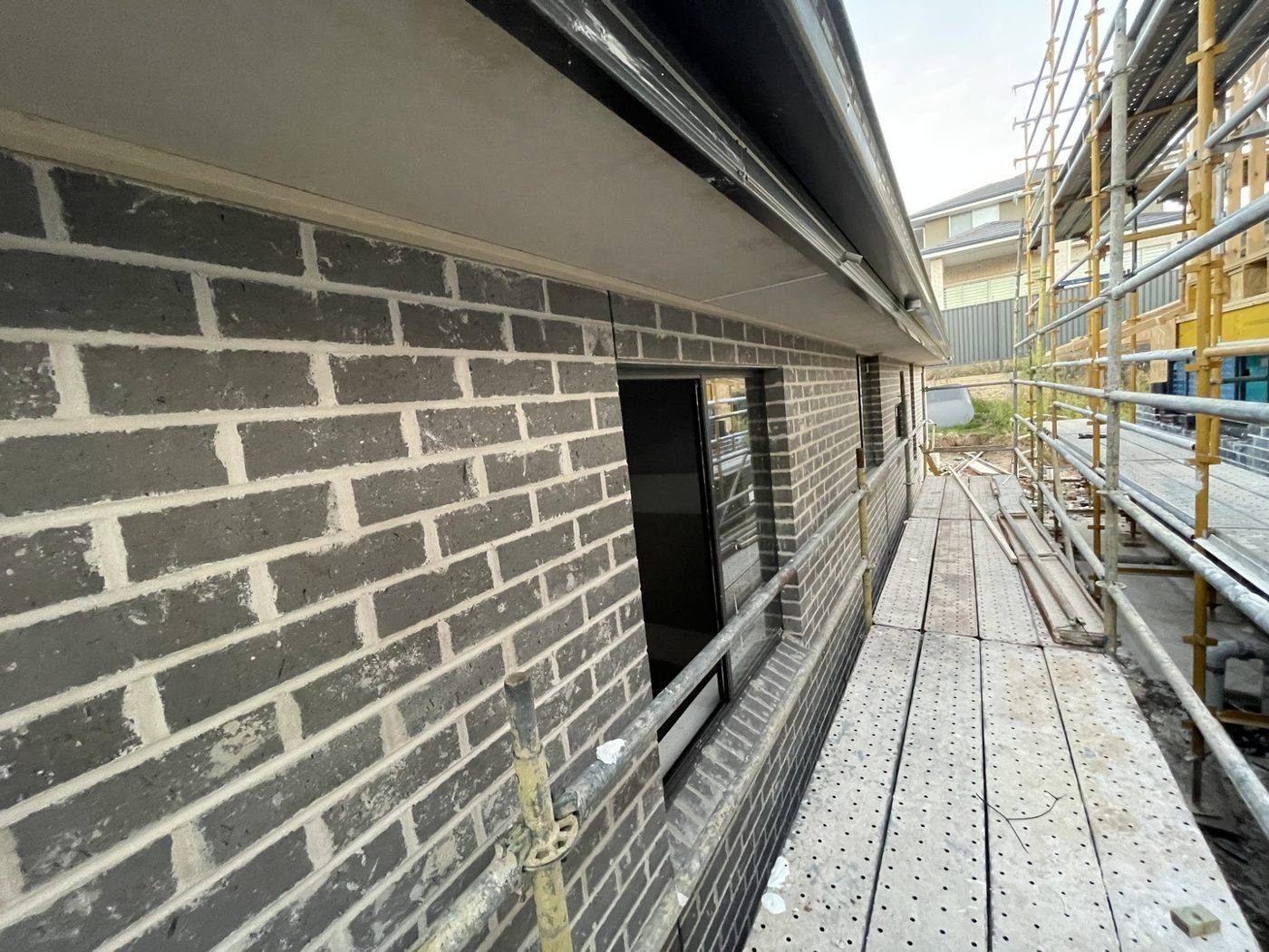 Brick wall run with fascia and eave line on a new build by Loel Homes
