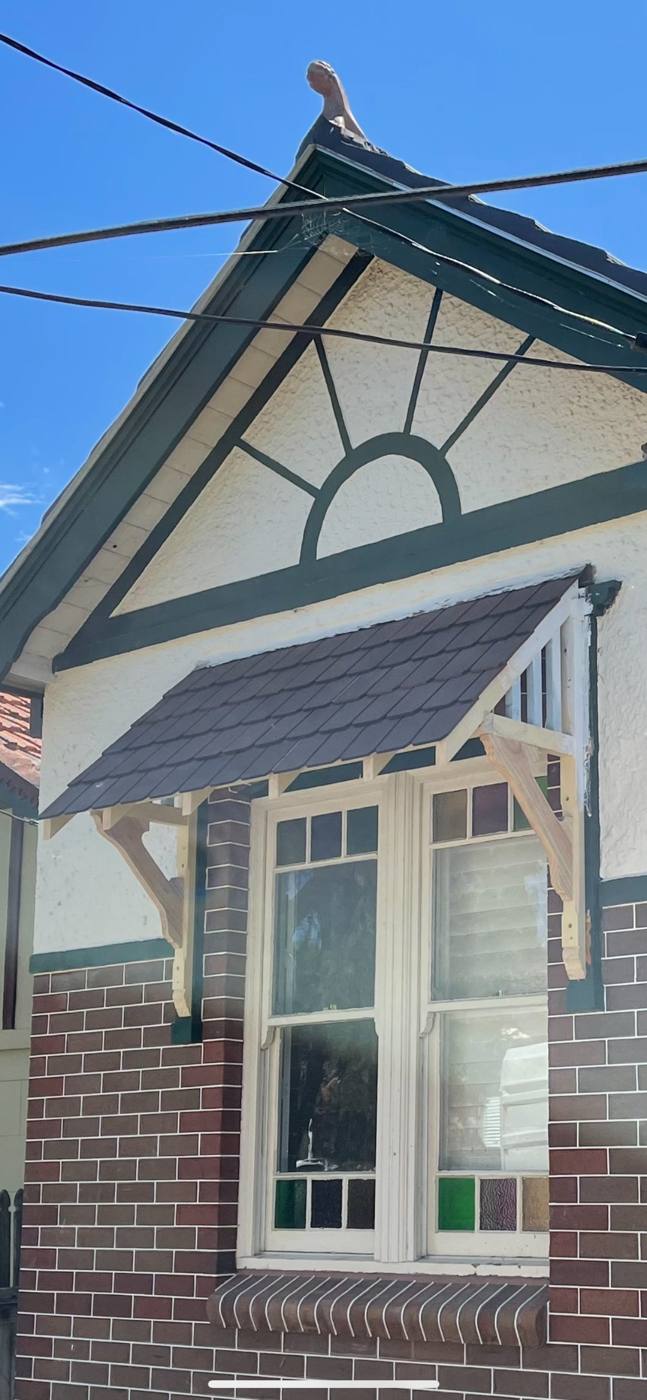 Finished heritage gable with sunburst fretwork and new tiled window bonnet over restored leadlight windows, Inner West by Loel Homes