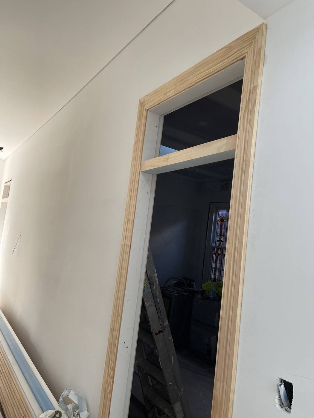 New internal doorway with timber architrave and highlight fanlight frame, heritage terrace carpentry by Loel Homes