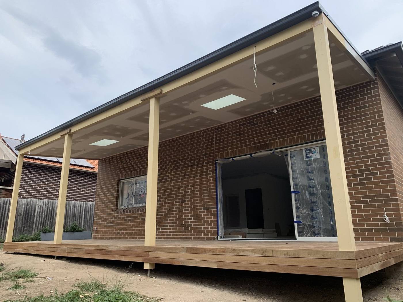 Covered verandah roof structure framed and lined over the new deck by Loel Homes